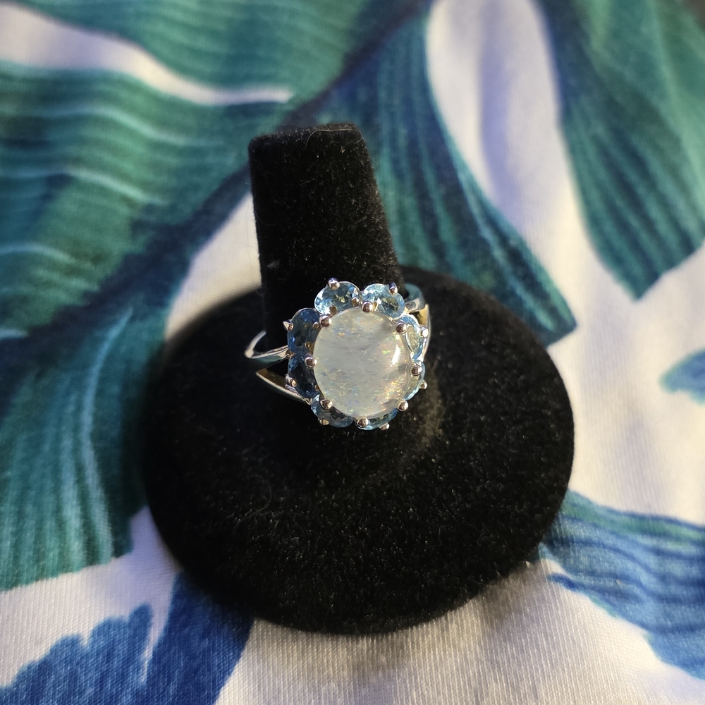 SS Skalet Manufacturing Oval Rainbow Moonstone Surrounded By Blue Topaz Ring.